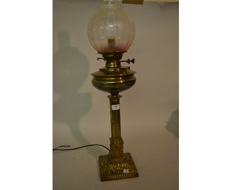 Brass oil lamp with chimney and shade converted for use with electricity
