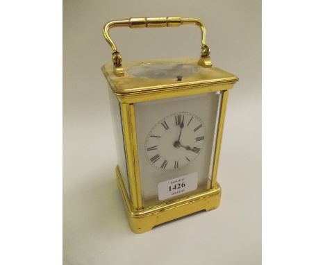 Early 20th Century gilt brass carriage clock, the enamel dial with Roman numerals, the two train movement with hour repeat fu