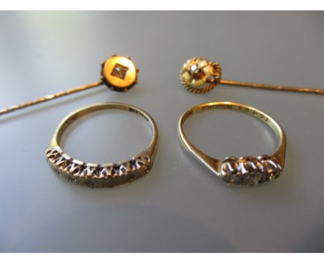 18ct Yellow gold three stone diamond set ring, another 9ct diamond chip set ring and two yellow metal diamond set stick pins