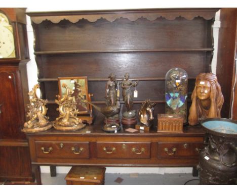 18th Century oak dresser with boarded shelf back above three drawers with brass swan neck handles, raised on cabriole front s