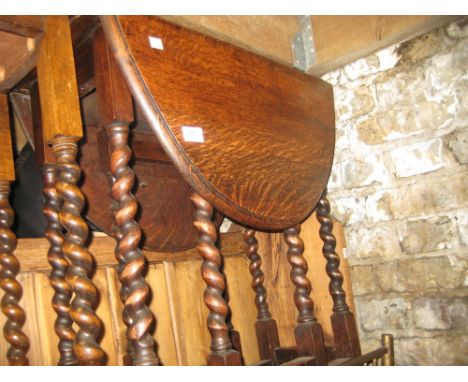 1940's Oak oval gate leg table on barley twist supports