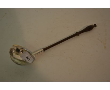 Antique white metal toddy ladle with double lipped bowl and turned fruitwood handle