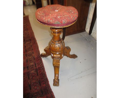 Victorian piano stool with swivel seat on tripod base