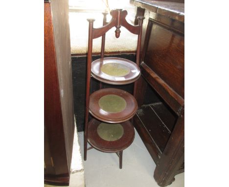 Circular mahogany three tier cake stand, a bed table, firescreen and a standard lamp