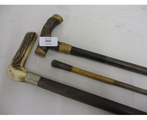 Silver mounted walking cane, another horn handled walking cane, swagger stick and a gilt metal mounted walking cane (cut down