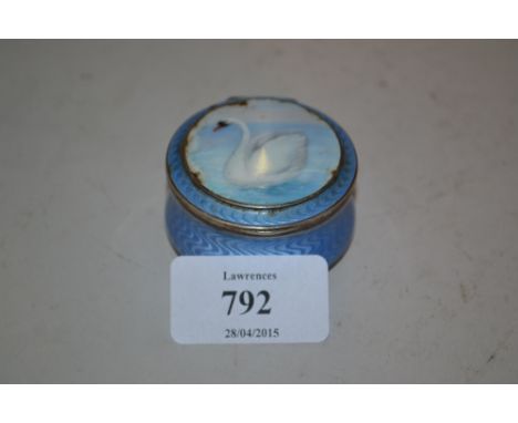Small circular blue enamel pot and cover decorated with a figure of a swan (a/f)