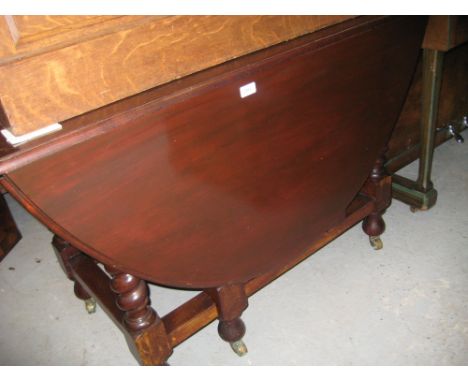 Large 20th Century oval gate leg table on barley twist supports with stretchers