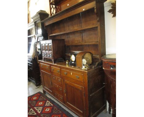 George III oak and pine dresser with a boarded shelf back above three small drawers with three simulated drawers flanked by t