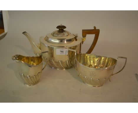 Silver three piece tea service of oval half fluted design, London 1901