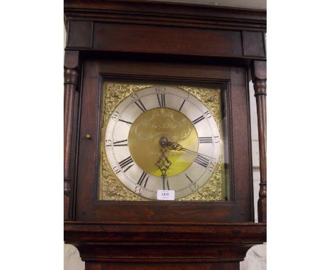 18th Century oak longcase clock having square hood with brass dial and silvered chapter ring with Roman numerals inscribed Ti