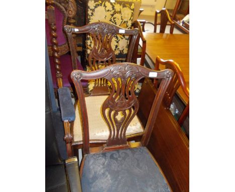 Pair of 19th Century mahogany side chairs in Chippendale style, with pierced splat backs, drop-in seats and square chamfered 