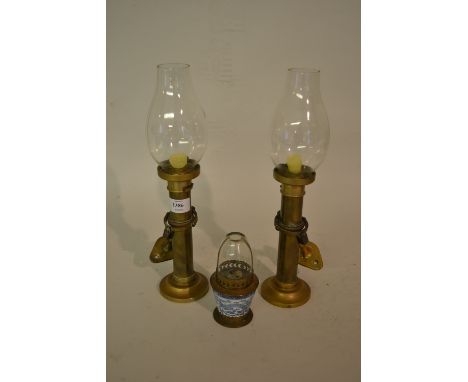 Pair of late 19th or early 20th Century brass ships candlesticks with glass shades and fitted gimbal wall mount with lead wei