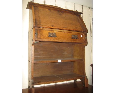 Early 20th Century oak bureau with a fall front above a single drawer and open shelves together with a small mahogany four sh