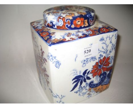 English pottery tea caddy decorated in iron red and blue together with a mid 20th Century painted terracotta figure of a gard