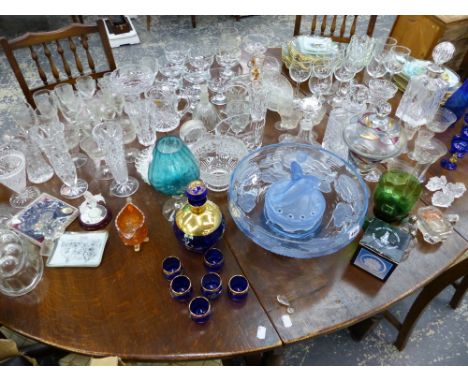 A LARGE VINTAGE BLUE GLASS CENTRE PIECE BOWL, A BLUE GLASS LIQUEUR SET, VARIOUS VASES AND DRINKING GLASSES.  