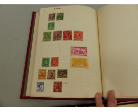A VINTAGE STRAND STAMP ALBUM AND CONTENTS TOGETHER WITH LOOSE STAMPS AND AN EMPTY ALBUM. 
