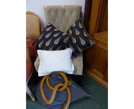 A BUTTON BACK CHAIR AND FOUR CUSHIONS AND ROPE BANISTER. 