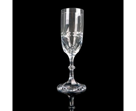 Elevate your toasting experience with the elegance of a fluted champagne glass. The glass features a faceted step and is ador