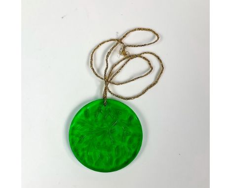 Green colored, annual edition ornament chased with mistletoe pattern in satin finish. Noel 1990 etched to rim. Lalique France