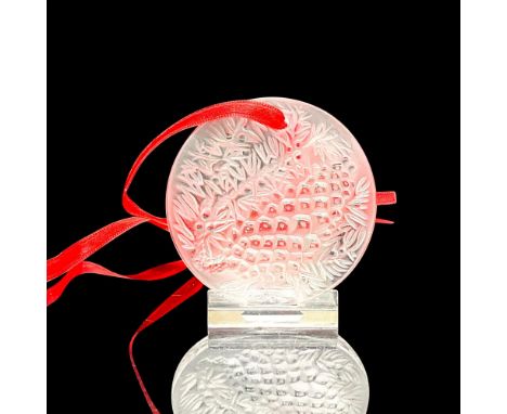 A round satin crystal tree ornament with an embossed image of a pine cone. Lalique France etched on the reverse side. Noel 20