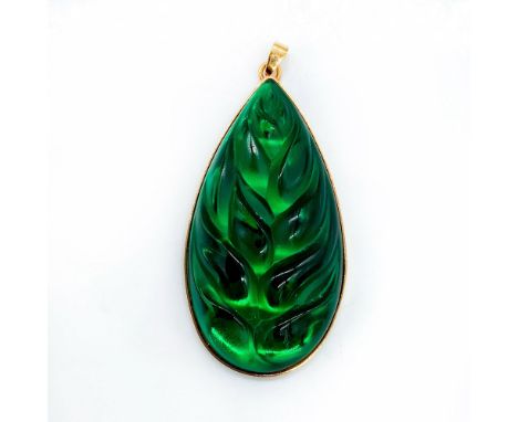 Inspired by the tropical Heliconia plants of the Caribbean. Marked Lalique France on gold plated back. Dimensions: 2.5"L x 1.