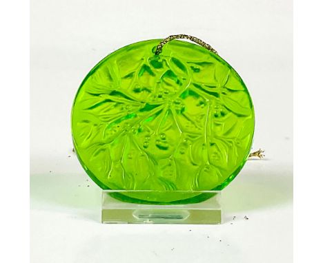 Green colored, annual edition ornament chased with mistletoe pattern in satin finish. Noel 1992 etched to rim. Lalique France