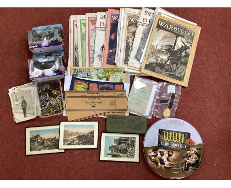 British Army 'The Wounded Stripe No.4', cap badges, rank and trade insignia, WWI German Army passbook, issues of 'The War Bud
