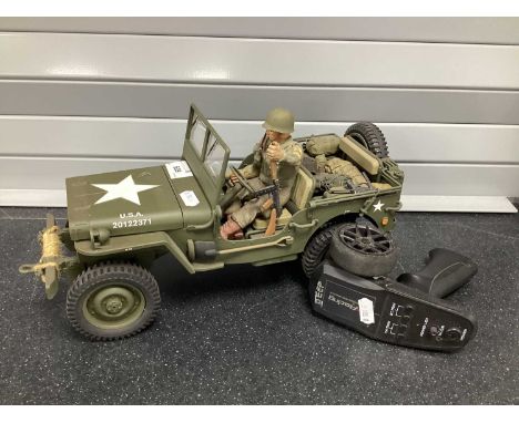 A Plastic Radio Controlled Model of a U.S. Army Willy's Jeep (U.S.A. 20122371) with controller and Cox Command Jeep Instructi