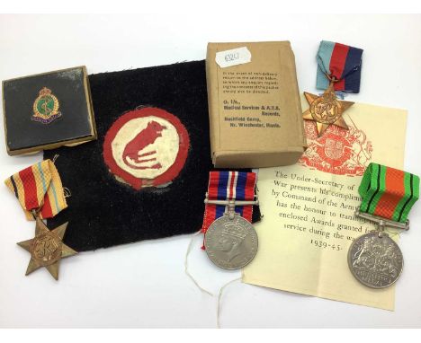 WWII British Medals, comprising 1939 - 1945 Star, Africa Star, Defence Medal and War Medal 1939 - 1945 in packets with box . 
