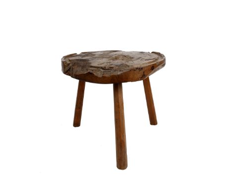 A large 19th century yew wood chopping board, raised on tripod legs. 50cm(d) x 44cm(h)