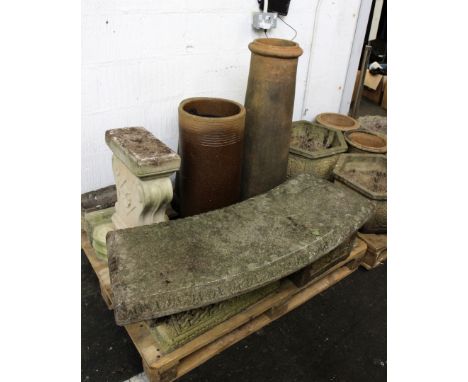 A collection of garden ware, to include a reconstituted stone bench, three large chimney pots, a pair of planters and a large