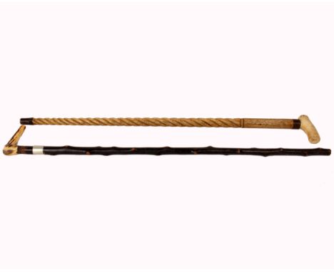 A marine ivory walking stick, Ivory handle with Narwhal tusk style fluted and swirled shaft, 64cm, together with another walk