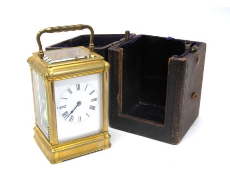 A Brass Repeater Carriage Clock, the twin barrel movement with platform escapement striking on a gong, the white enamel dial 