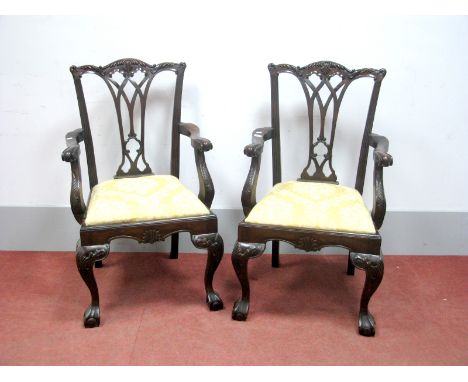 A Pair of XX Century Mahogany Carver Chairs, in the Chippendale style, with pierced splat back, carved scrollwork to cresting