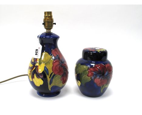 A Moorcroft Pottery Table Lamp, of ovoid form, painted in the 'Hibiscus' pattern against a dark blue ground, impressed marks,