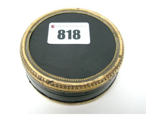An Early XIX Century Circular Lacquer Box, with gilt metal mounts, the cover painted with a portrait of a girl holding a bask