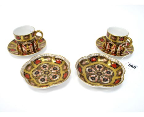 A Pair of Royal Crown Derby Porcelain Coffee Cans and Saucers, decorated in Imari pattern 1128, date code for 1995; A Pair of