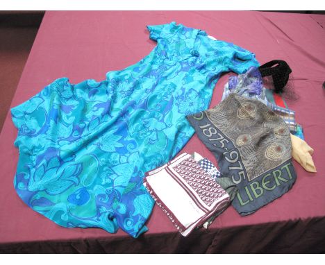 A Liberty of London Vintage Centenary Silk Scarf, in the Hera design with peacock feathers, in green; a Louis Féraud silk sca