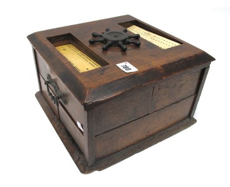 A Late XIX Century Oak Cased Games Compendium, the four drawers containing bone chess and draughts sets, ivory poker dice, sh