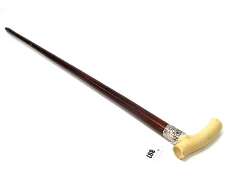 A Late Victorian Ivory Handled Walking Stick, mounted on a malacca cane with chased silver collar inscribed and dated 1895, 9