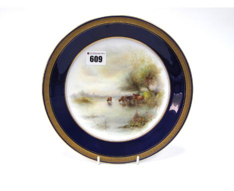 A Royal Worcester Porcelain Plate, of circular form, painted by Harry Stinton, signed, with cattle on a river bank, within a 