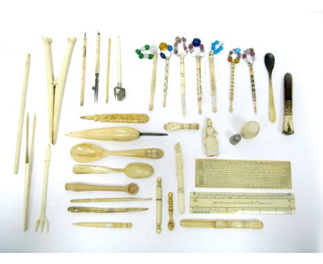 Seven Mid XIX Century Bone Lace Makers Bobbins, with attached glass beads, one inscribed "My Love, Love MR"; a pair of bone g