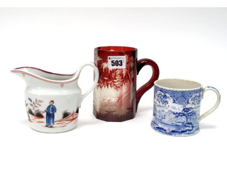 A Late XIX Century Bohemian Glass Tankard, of faceted form, the ruby ground etched with two dogs in a wooded landscape, 13cm 