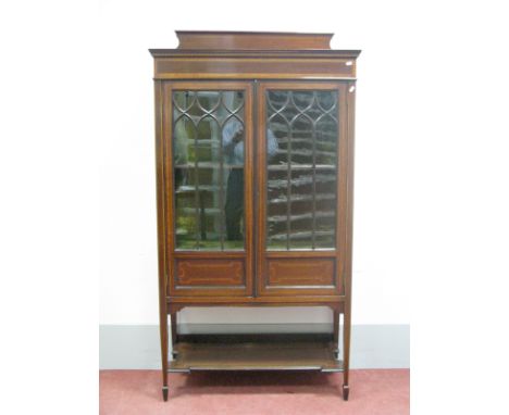 An Edwardian Mahogany Inlaid Display Cabinet, with low back, glazed astragal doors, internal shelf, on tapering legs with spa