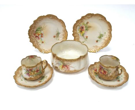 An Early XX Century Nautilus Porcelain Tea Service, of moulded fluted form, painted with flowers and fruit, printed marks, co