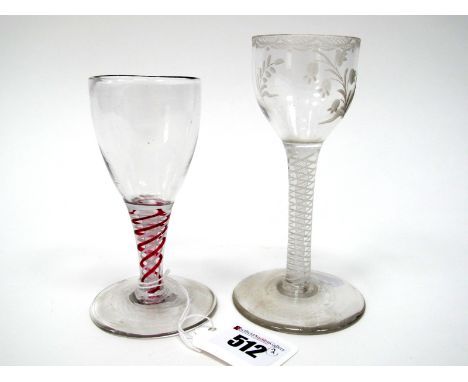 An XVIII Century Wine Glass, the ogee bowl etched with floral sprigs within a swag border, raised on a white enamel twist ste