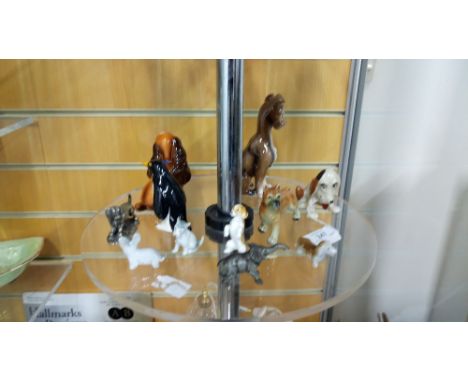 SHELF OF ANIMAL ORNAMENTS