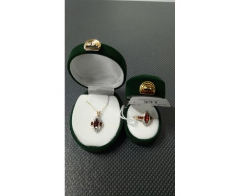 RING AND PENDANT SET WITH LARGE MARQUISATE CUT GARNET SMALLER GARNETS & DIAMONDS IN 9CT GOLD