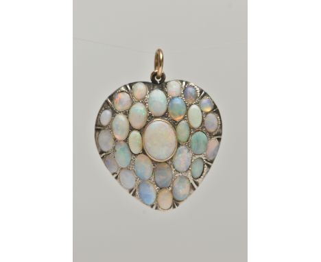 AN EARLY 20TH CENTURY HEART SHAPE OPAL CABOCHON PENDANT, set with mainly oval shape opals, length 3.5cms, approximate weight 