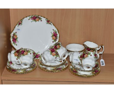 A TWENTY ONE PIECE ROYAL ALBERT OLD COUNTRY ROSES TEA SET, comprising a cake plate, a cream jug, a sugar bowl, six teacups, s